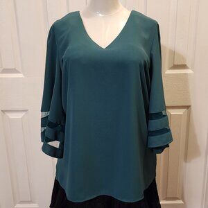 Lookbook V neck top with 3/4 bell sleeves with mesh insert in dark green/emerald